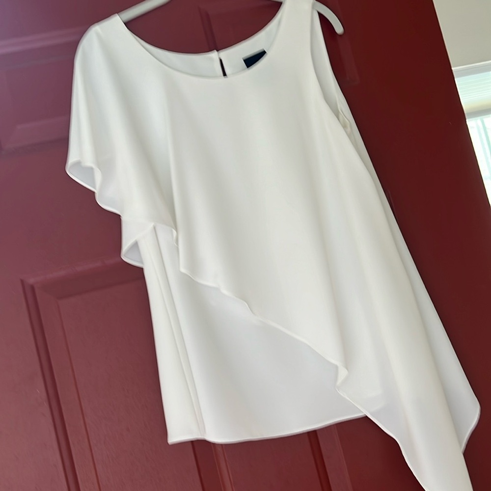 Beautiful white blouse never worn  sleeveless on left draping on right